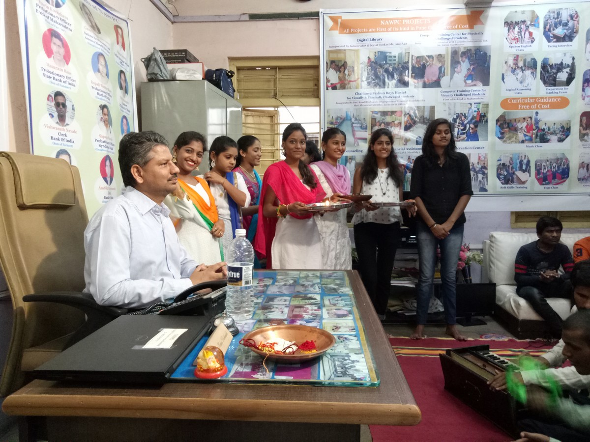 NSS volunteers with the president of NAWPC- Celebrating Rakhi Pournima