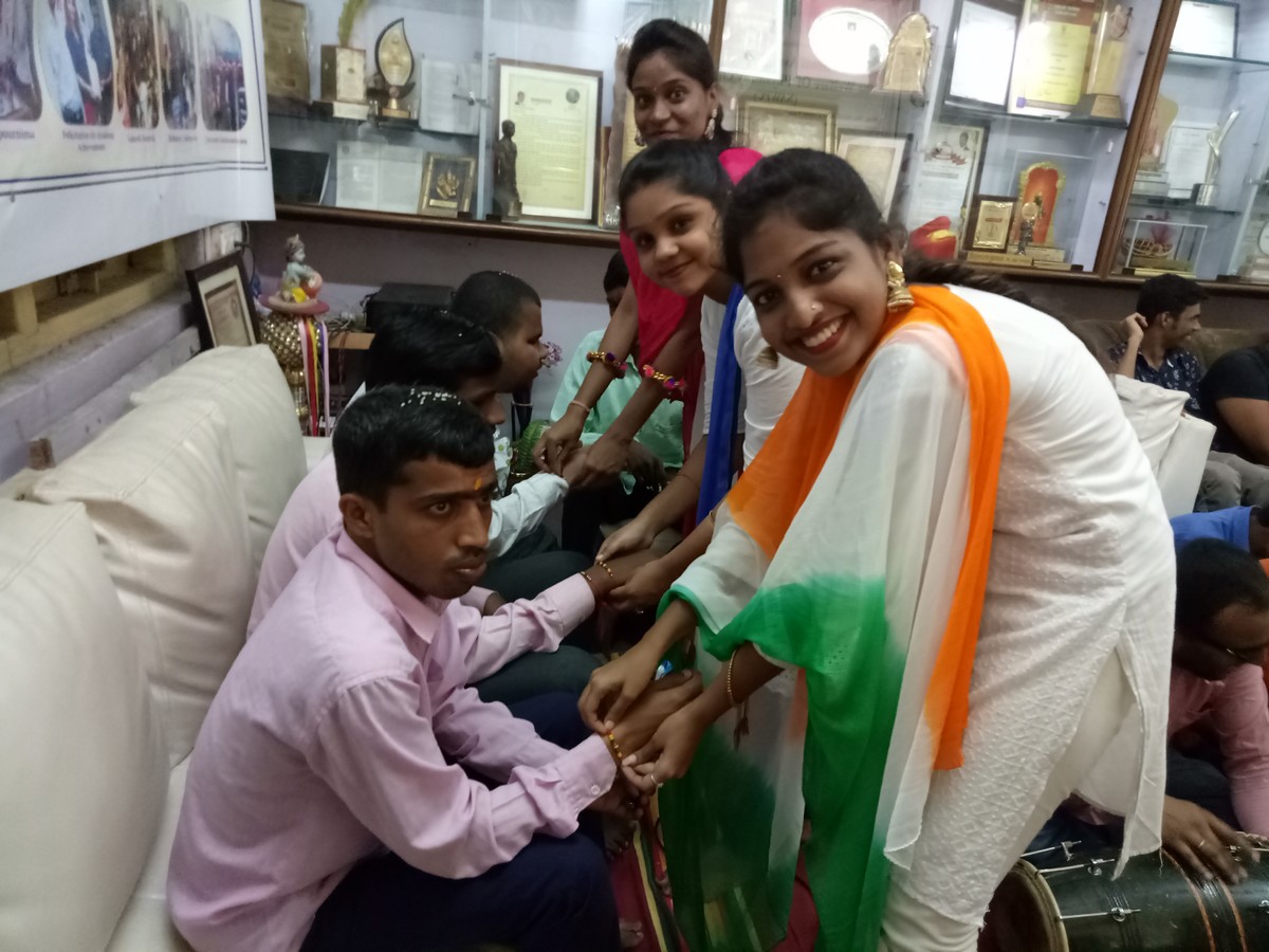 NSS volunteers with visually impaired students  of NAWPC- Celebrating Rakhi Pournima