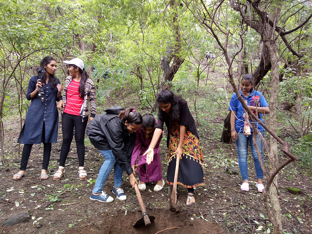 NSS Volkunteers taking pits at the SPPU Hill