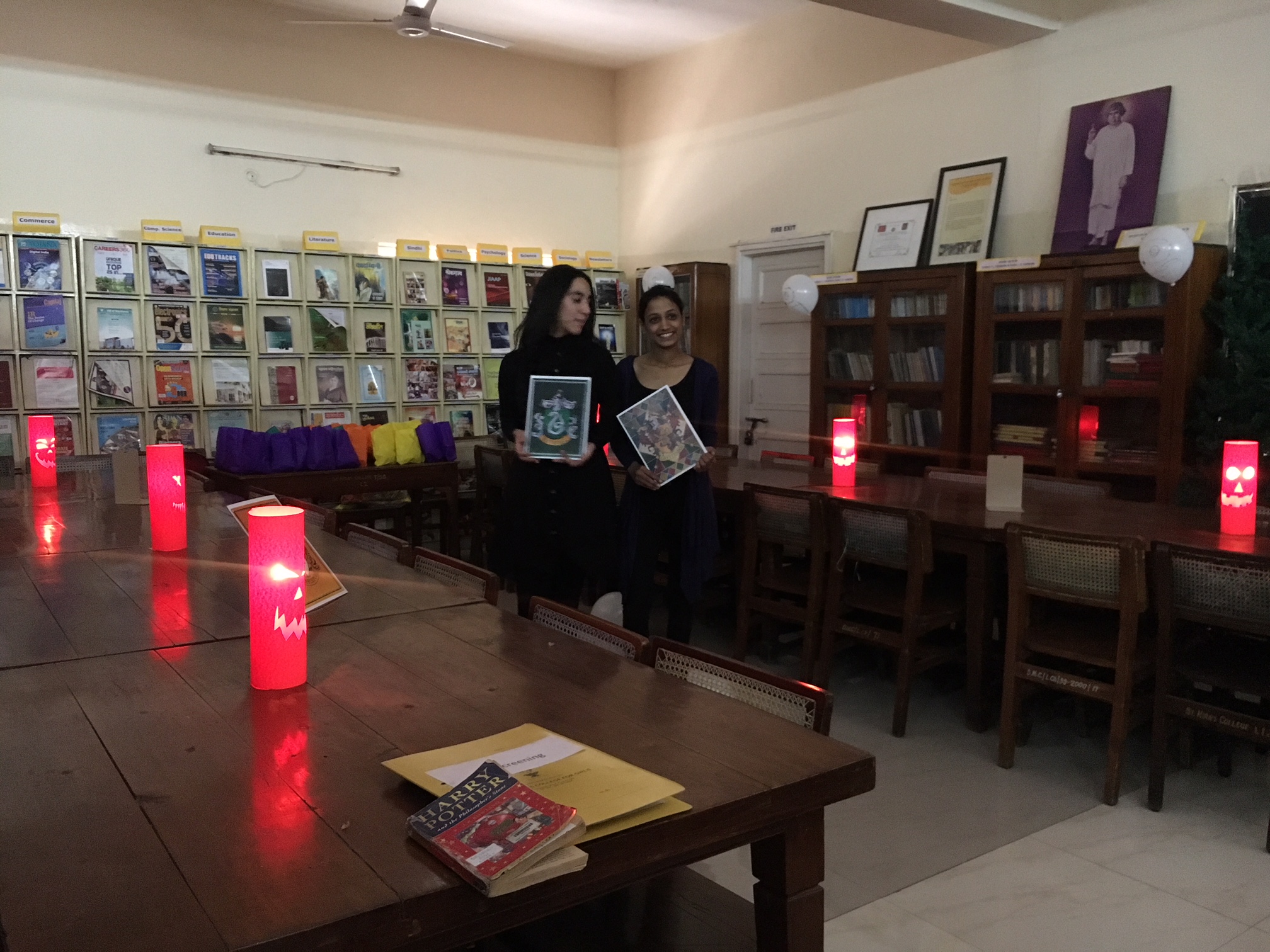 A perfect Harry Potter Ambience created with Lanterns, baloons with owl painting on it and House Flags