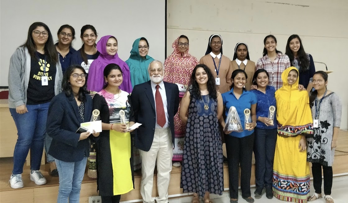 The judges, Mr. Suraj Sriram and Ms. Priyanka Menon, and the winners with the Debate
								Organizing Committee.