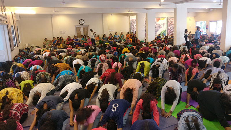 Students while performing sasankasana