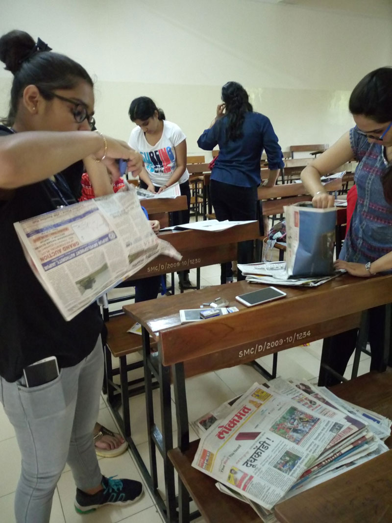 Green Guardians' Newspaper Bag-making Activity in progress