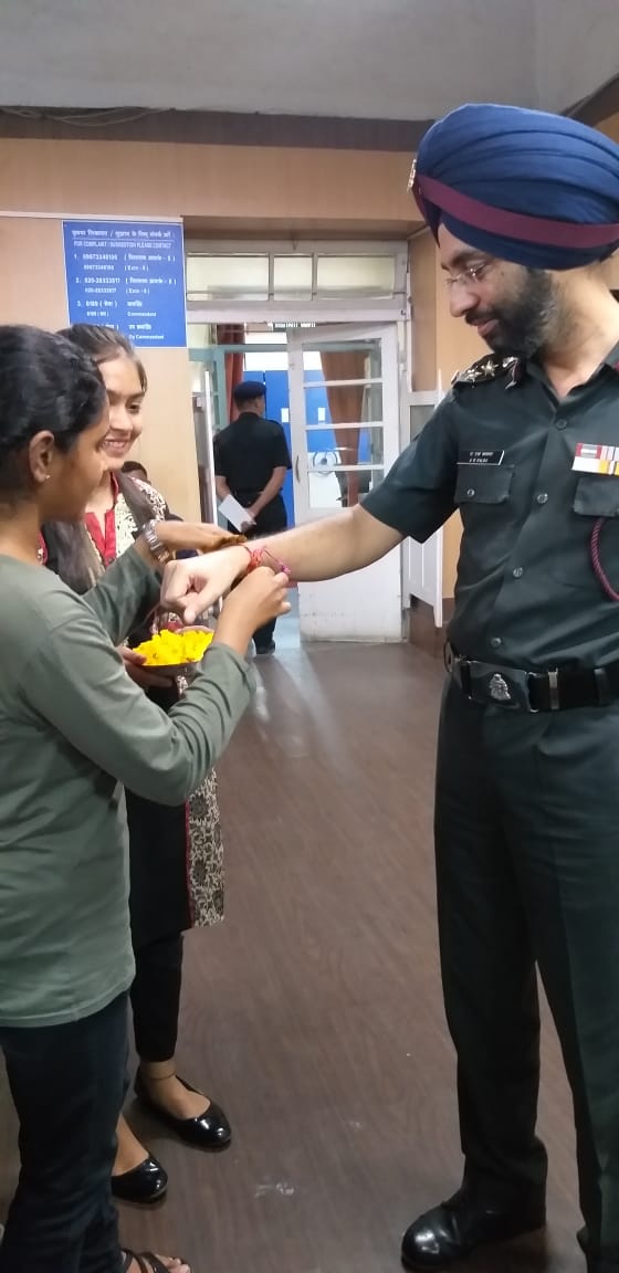 Green Club students tying hand-made Rakhi to Deputy Commandant Kalra , ALC, Pune 8th Aug, 2019