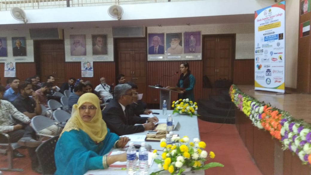 Student Presenting Paper at an International Conference  held at Abeda Inamdar College.